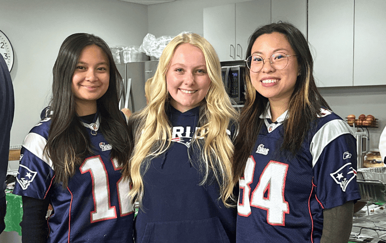 LGA, LLP team members together in our Woburn office wearing jerseys to celebrate Super Bowl Spirit Day.
